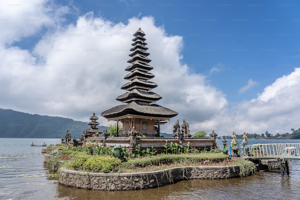 The Pura Ulun Danu Bratan temple in Indonesia with the white clouds in the background