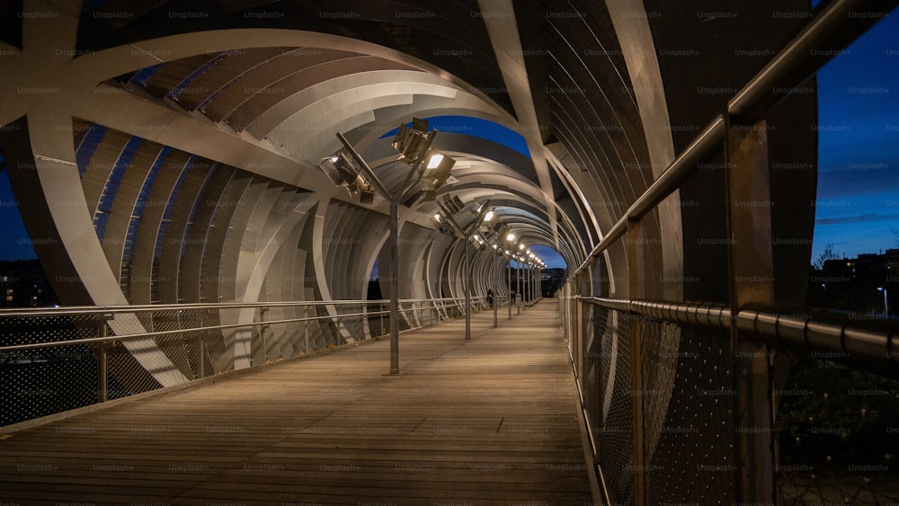 A inside the spectacular Arganzuela footbridge enclosed with spiraling metal design