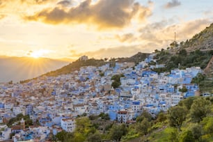 A breathtaking Chefchaouen view from Spanish Mosque, Morocco against colorful sunset sky