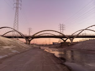 A Beautiful view of LA river with 6th street bridge against sunset