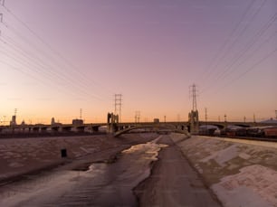 A Beautiful view of LA river with 6th street bridge against sunset