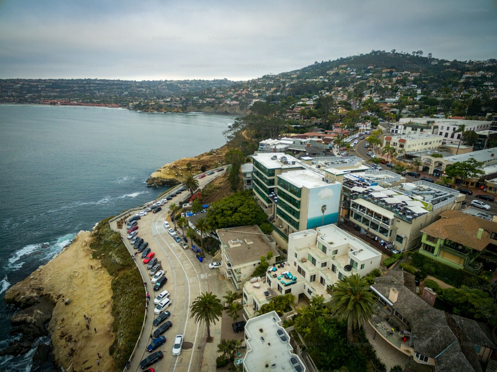 A drone shot of the Pacific Ocean and the La Jolla seaside neighborhood in San Diego, California, on a cloudy day