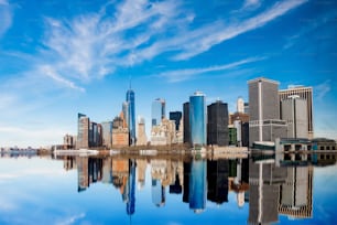 A breathtaking view of Manhattan buildings reflection in the Hudson River
