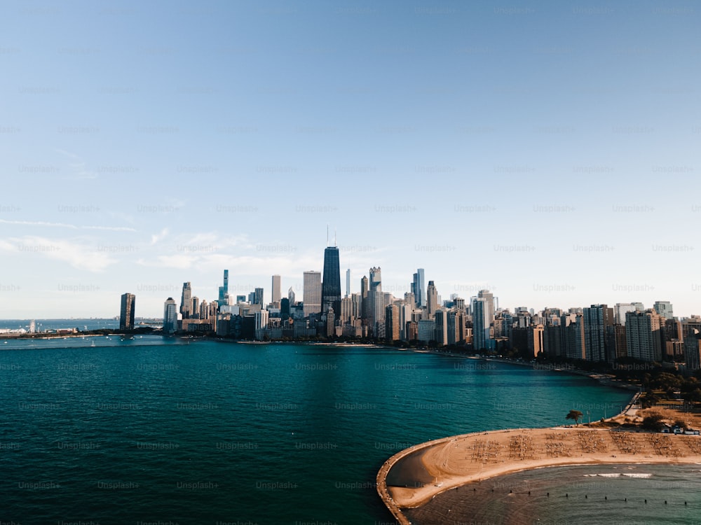 An aerial of North Avenue Beach of lake Michigan in Lincolns park in Chicago against the city skyline