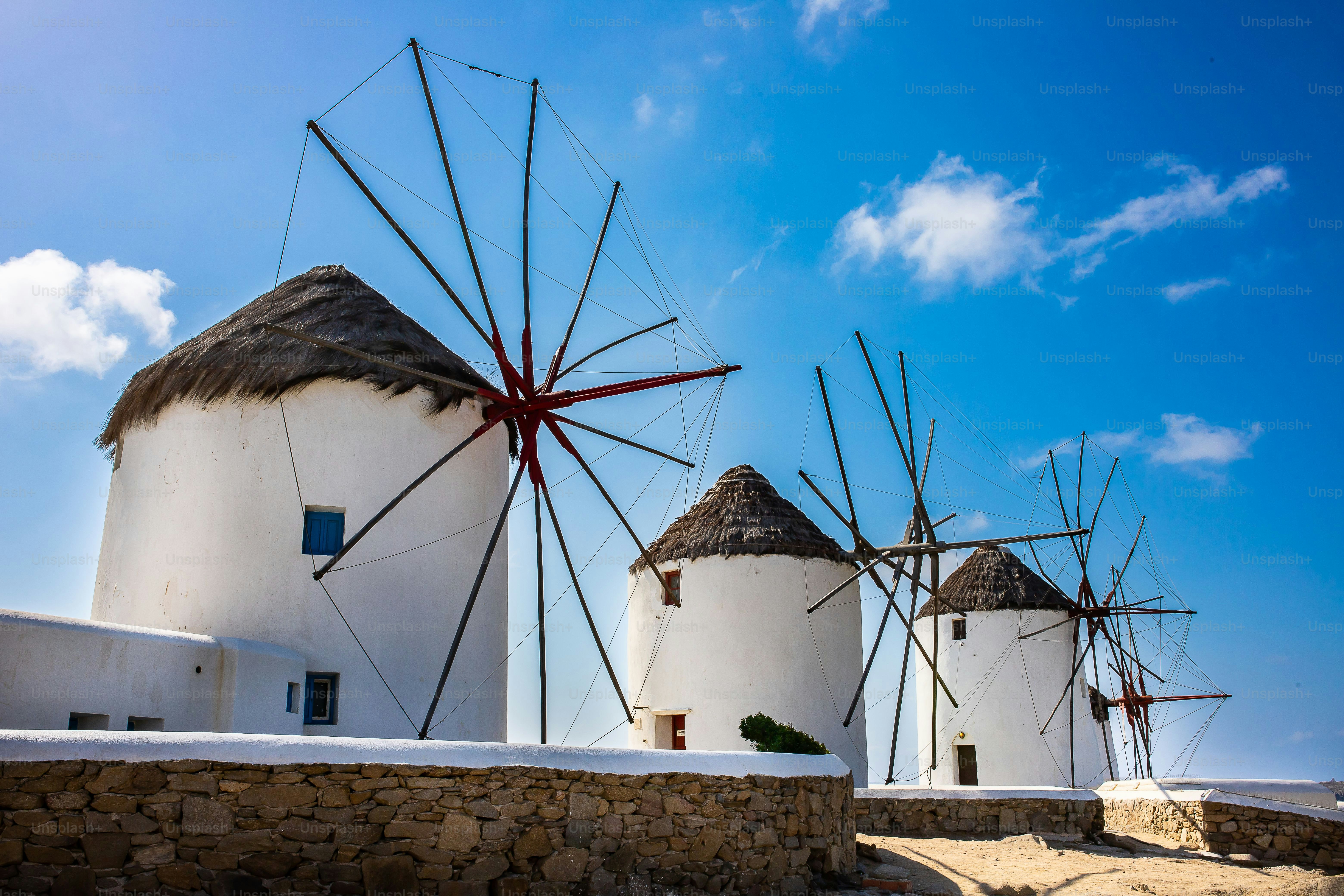 A beautiful shot of the Windmills of Mykonos under the clouds in Greece