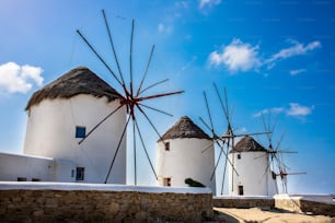 A beautiful shot of the Windmills of Mykonos under the clouds in Greece