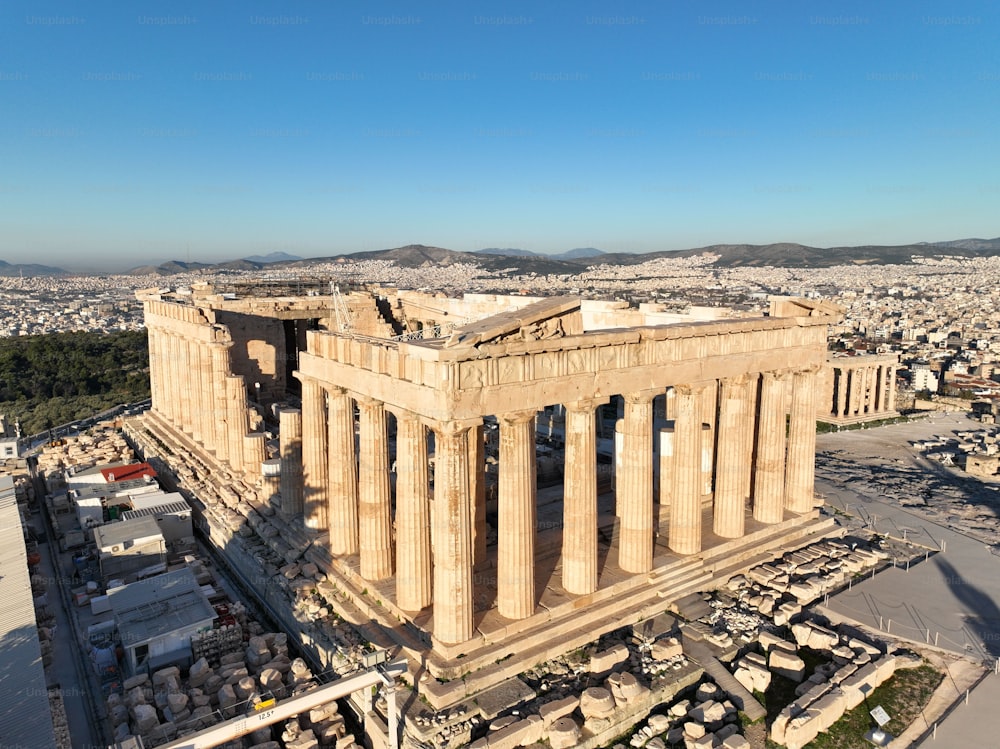 A drone view of the Parthenon on a sunny day in Athens, Greece