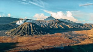 An aerial view of Mount Bromo volcano under blue cloudy sky in Indonesia