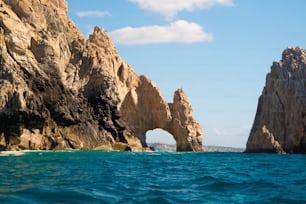 A beautiful shot of the Cabo San Lucas Arch on the Pacific Ocean with blue clean water on a sunny day