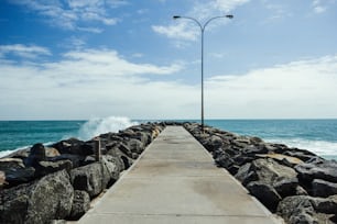 Samll wave hitting a rocky jetty