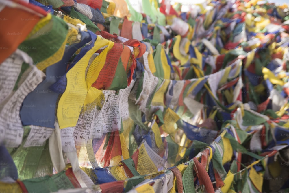 tibetan flags hanging from a buddhist temple in ladakh, india