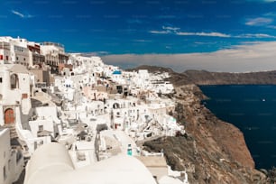 The beautiful view of traditional white Greek buildings on the cliffs. Paros, Greece.