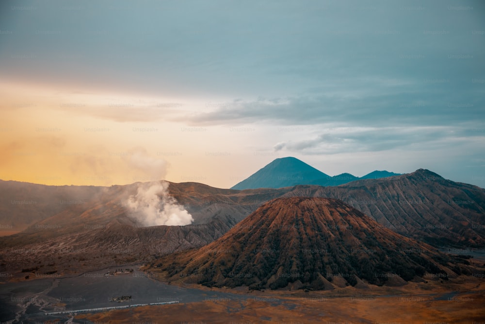 The Bromo Tengger Semeru National Park in Indonesia, with calderas, mountains, and a colorful sky