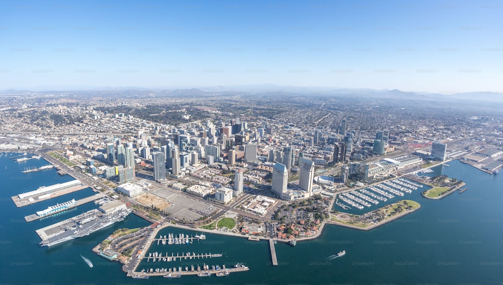 An aerial shot of the cityscape of downtown San Diego, California, surrounded by the ocean