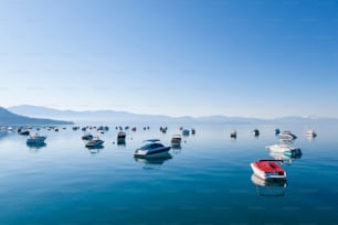 The boats in the transparent water of Lake Tahoe under a clear blue sky in the USA.