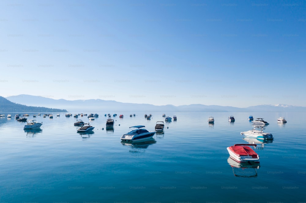 The boats in the transparent water of Lake Tahoe under a clear blue sky in the USA.