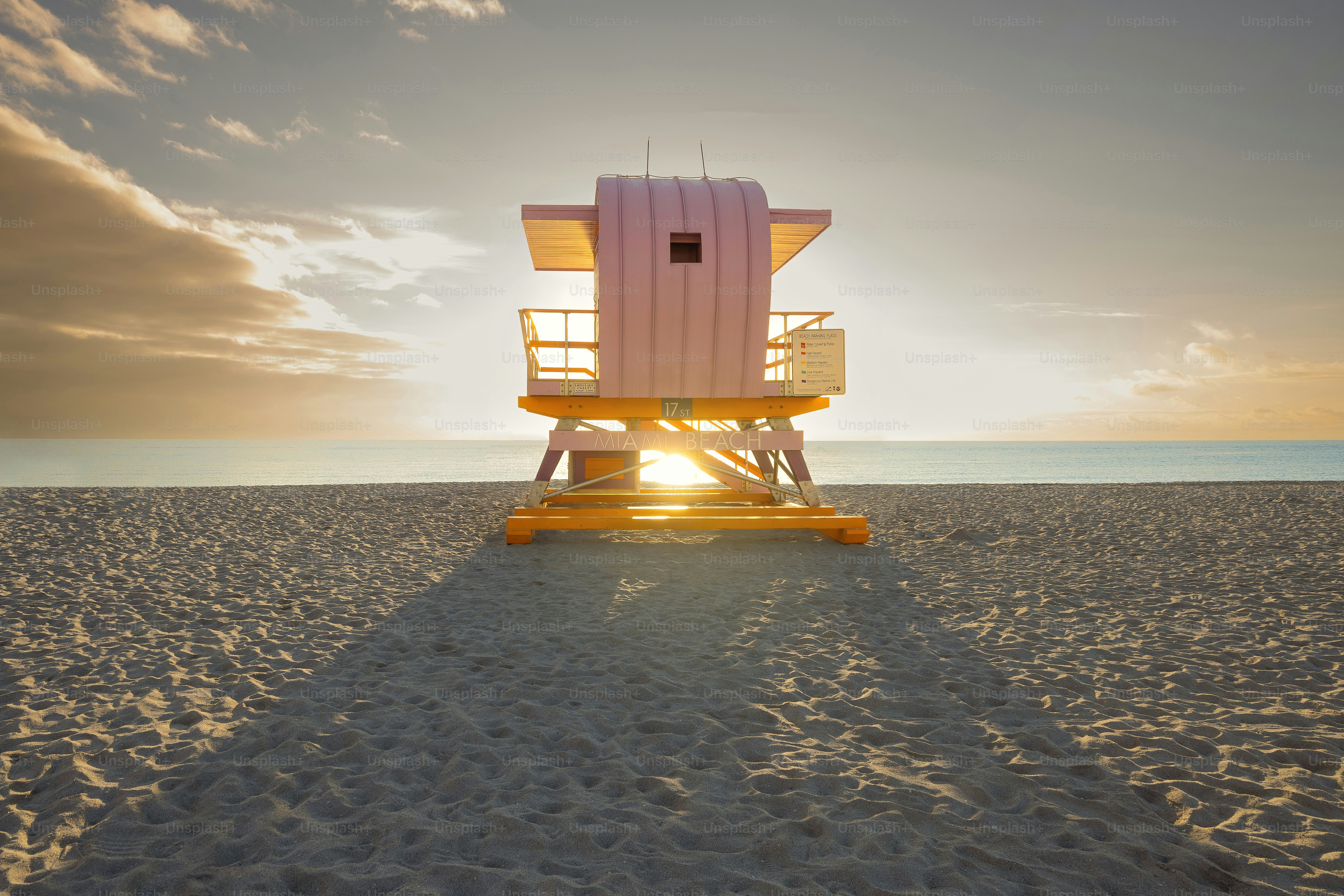 A pi lifeguard tower on the beach during sunset in South Pointe Park, Miami, Florida