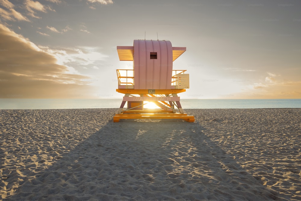 A pi lifeguard tower on the beach during sunset in South Pointe Park, Miami, Florida
