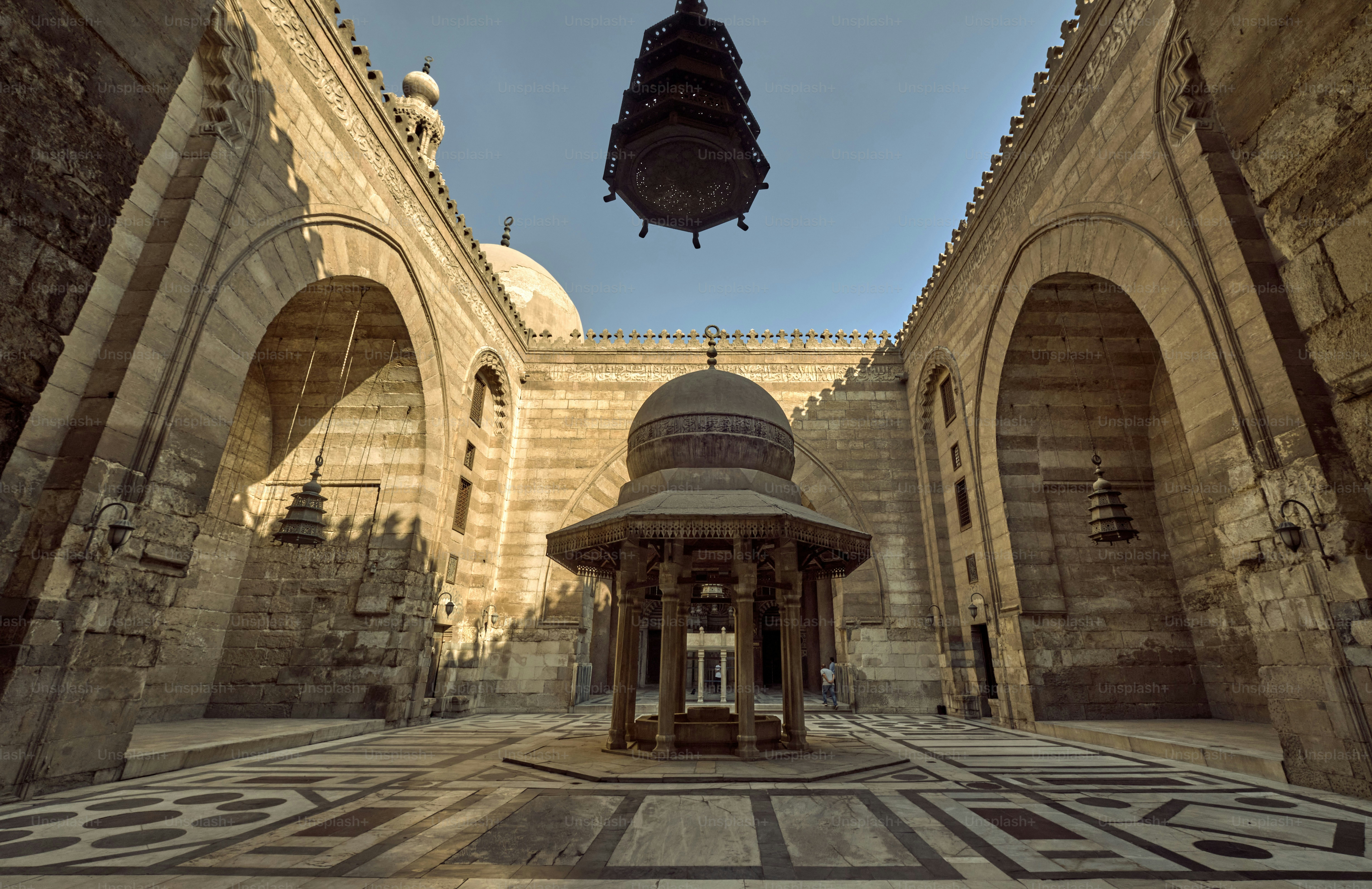 A Medieval Cairo's mosque-madrasa with intricate decorations and architectural features