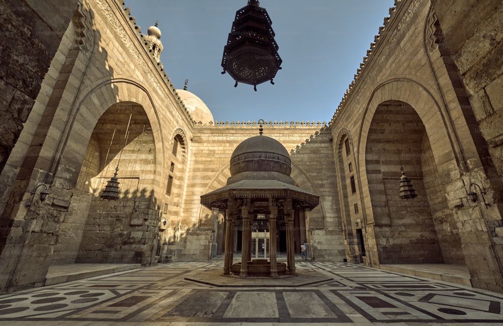 A Medieval Cairo's mosque-madrasa with intricate decorations and architectural features