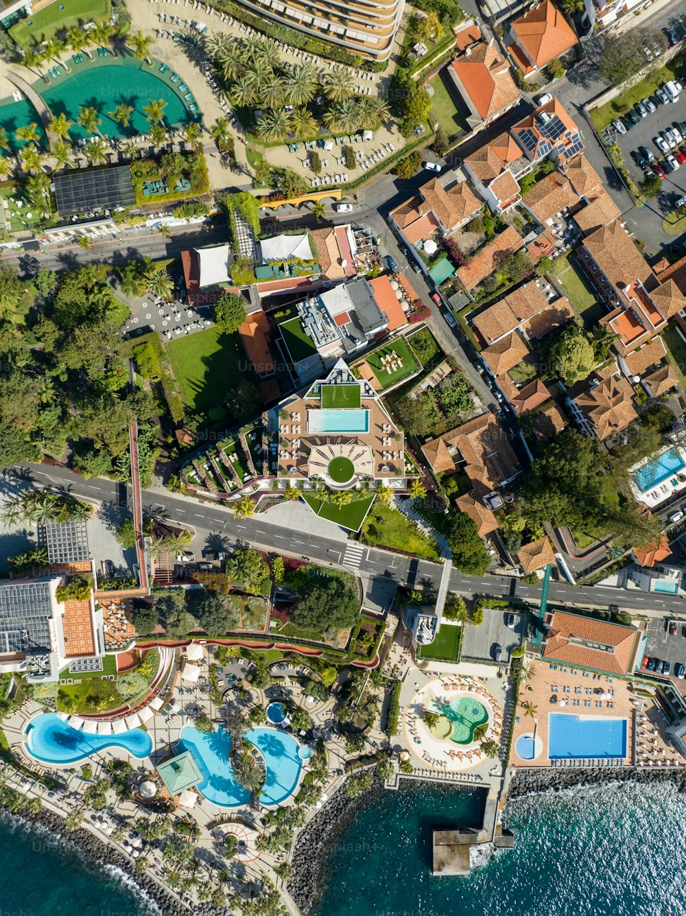 An aerial view of a luxury resort and beach in Funchal, Madeira Island, Portugal