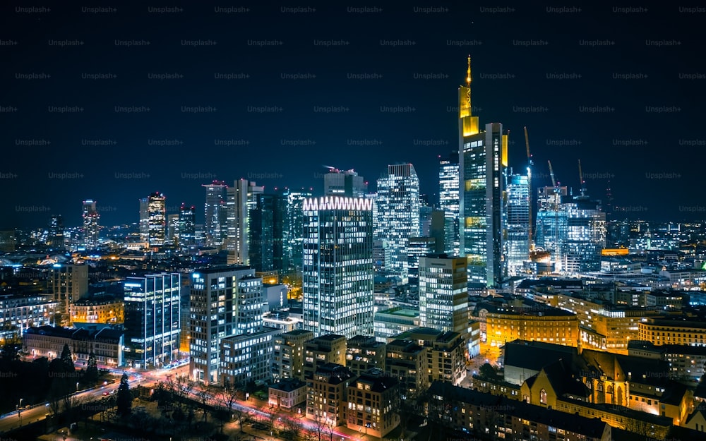 An aerial view of the illuminated skyline of Frankfurt am Main, Germany at night