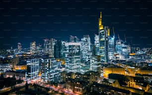 An aerial view of the illuminated skyline of Frankfurt am Main, Germany at night