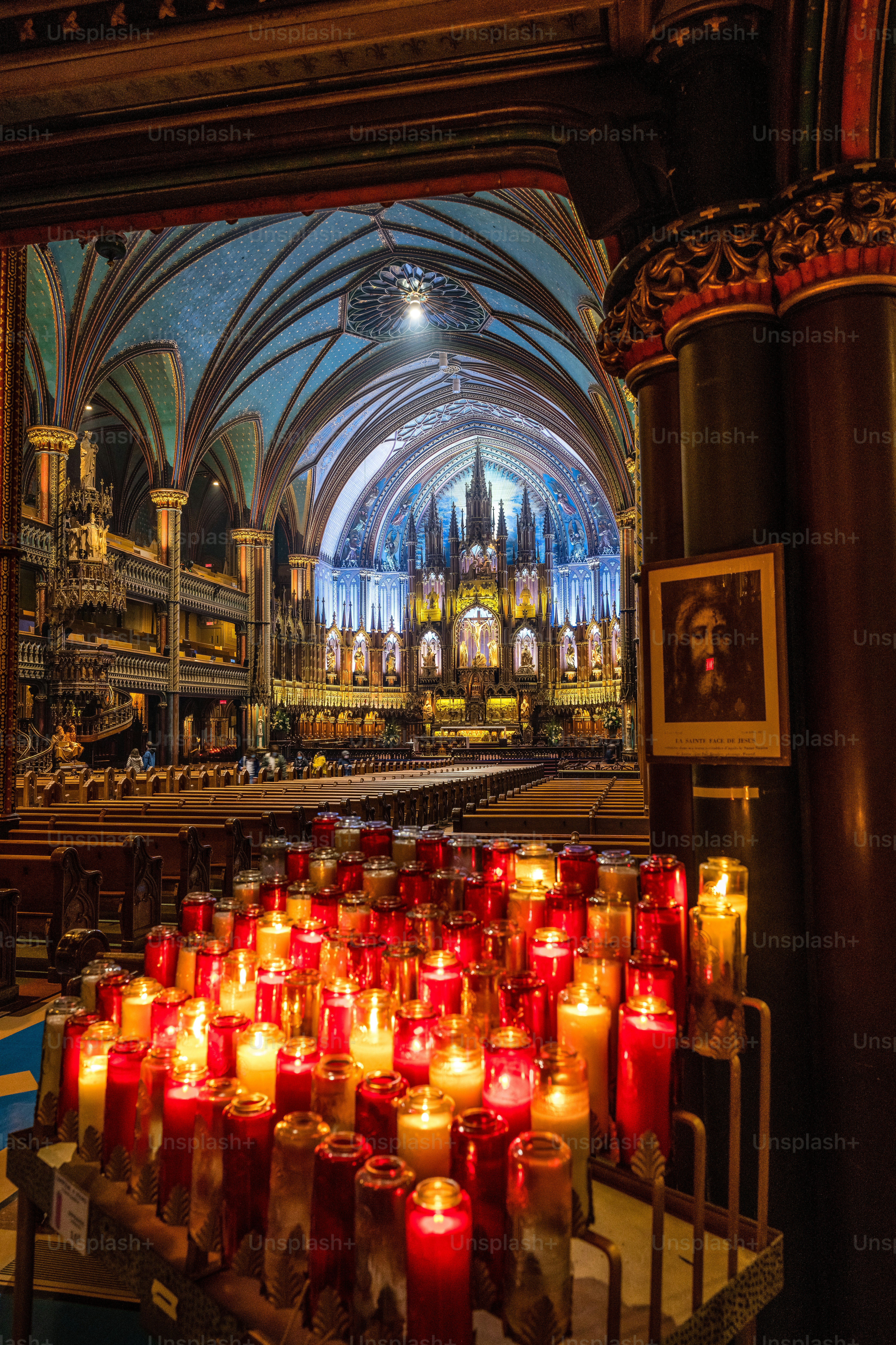 A peaceful scene with candles burning in Montreal Notre-Dame Basilica, Canada
