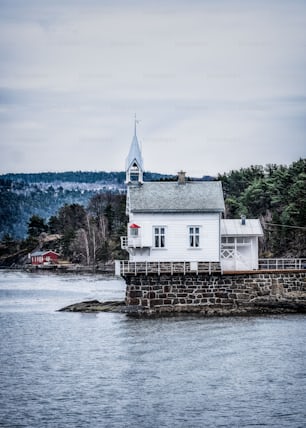 The historic Heggholmen wooden lighthouse at Oslofjord at the mouth of Oslo harbor