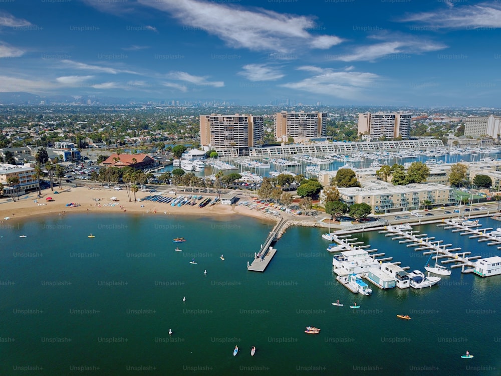 An aerial view of Marina's Beach with the city in the background, in Marina del Rey, California