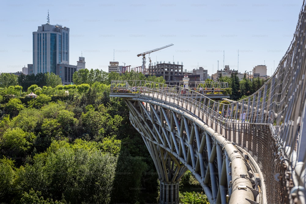 Tabi'at Bridge links two large urban parks in Tehran over a busy freeway.