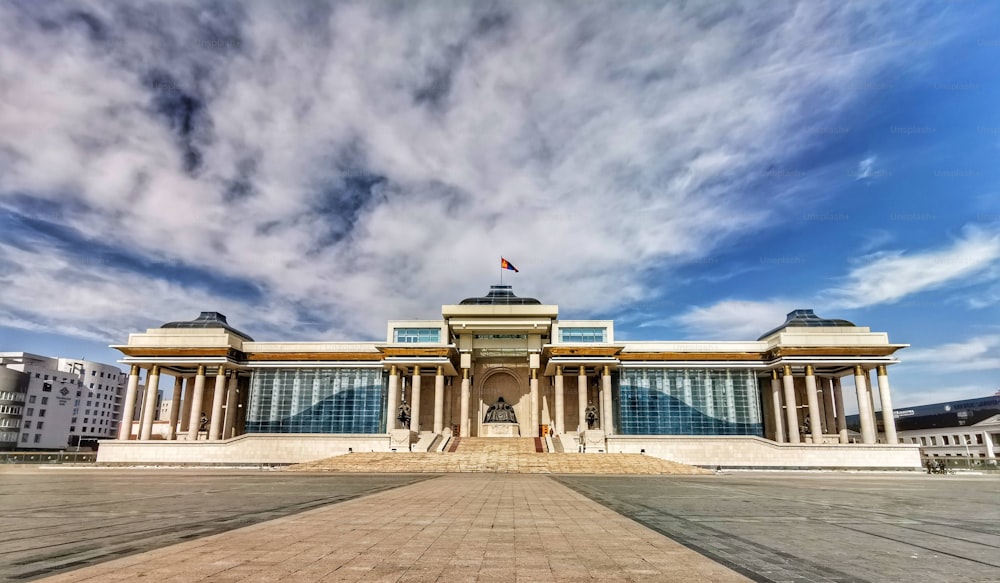 The Government Palace under a cloudy blue sky in  Ulaanbaatar, Mongolia.