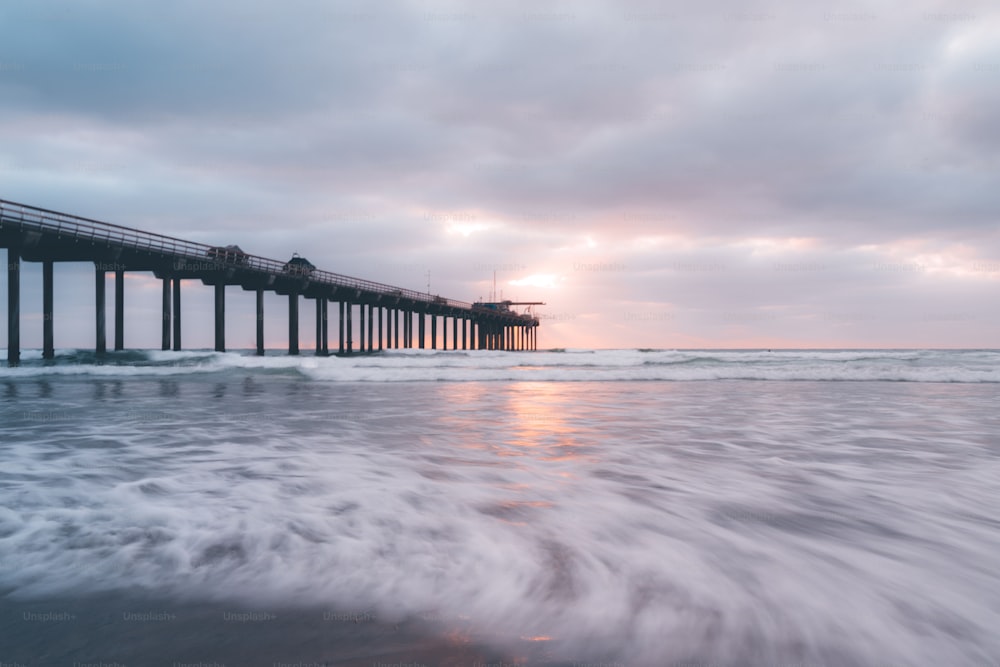 A silhouette of Scripps bridge on the sunset