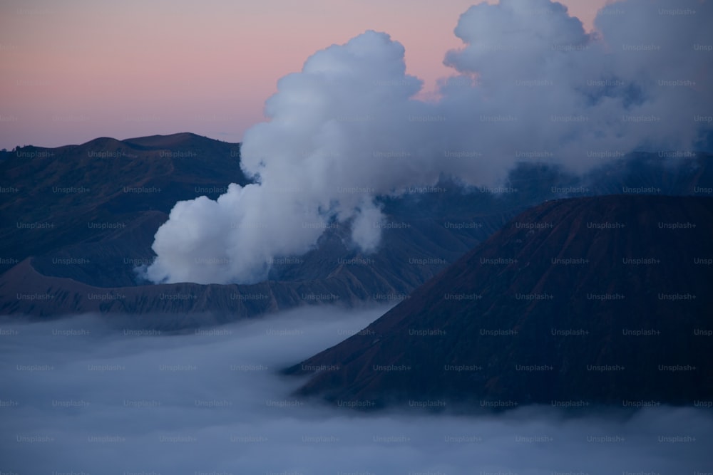 Aerial view of the Mount Bromo at sunrise over blanket clouds, active volcano in East Java, Indonesia.