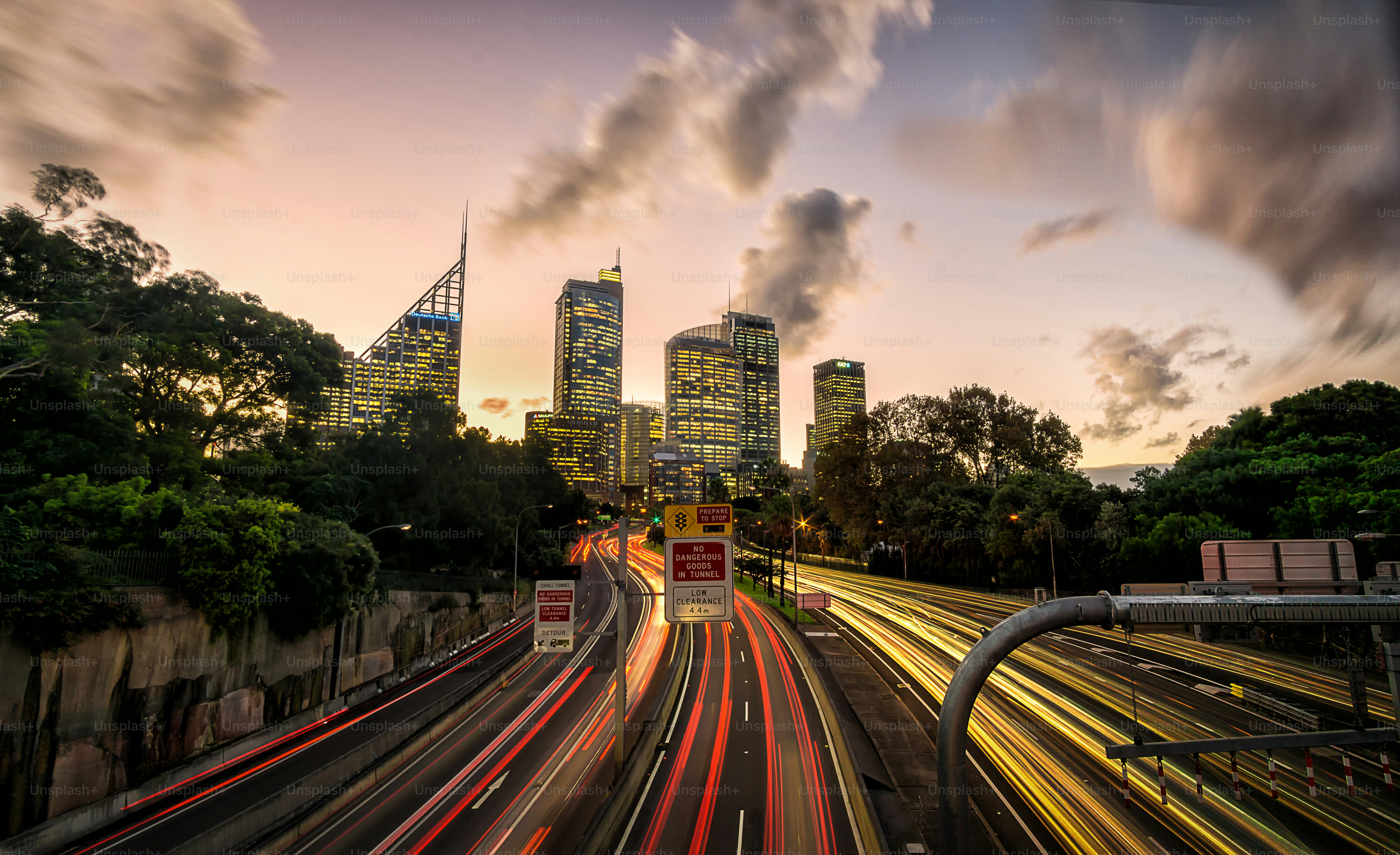 Sydney downtown at sunset with cars passing by