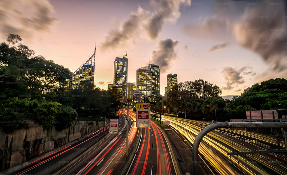 Sydney downtown at sunset with cars passing by