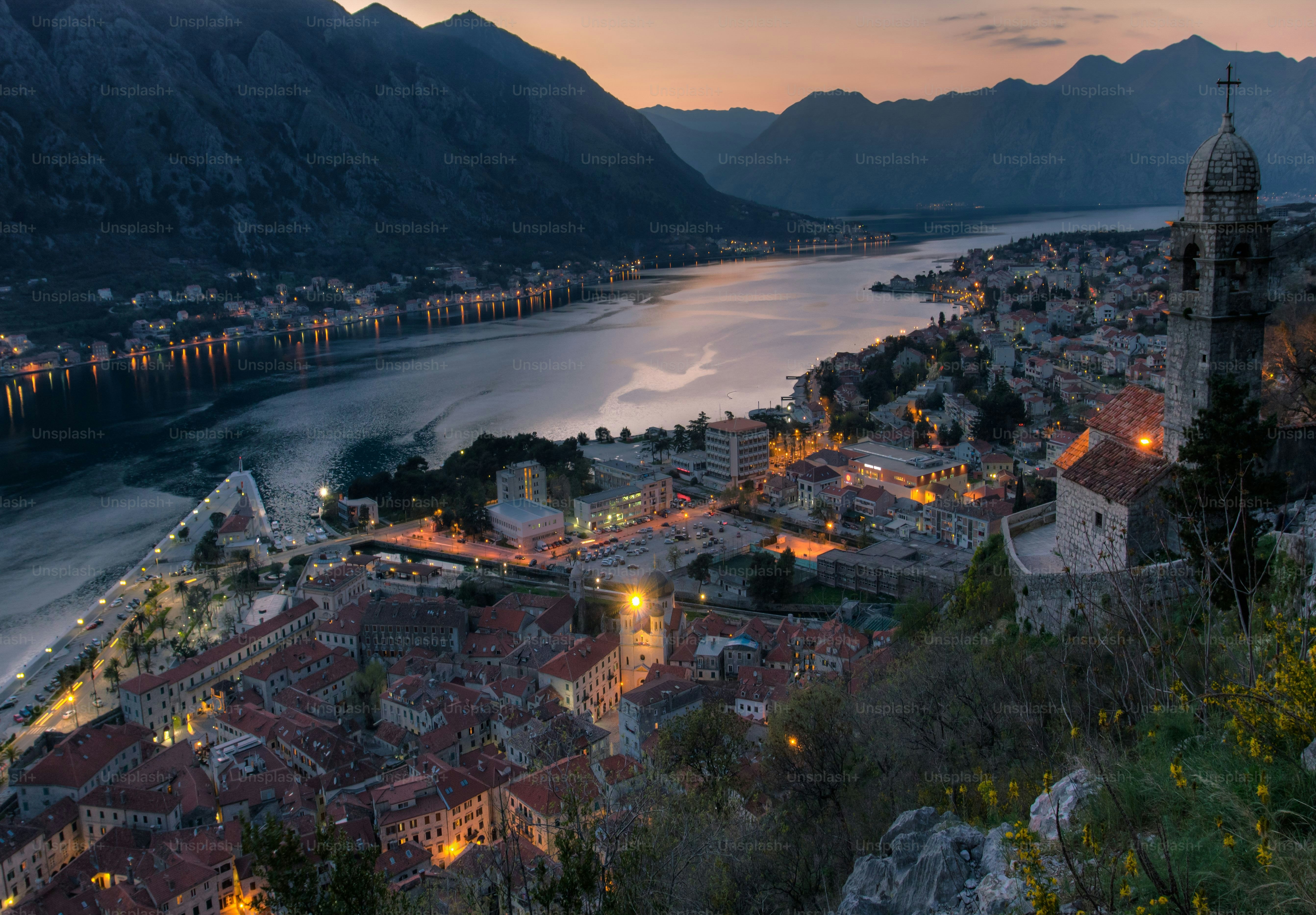 An aerial view of the city of Kotor in mountains in Montenegro at sunset