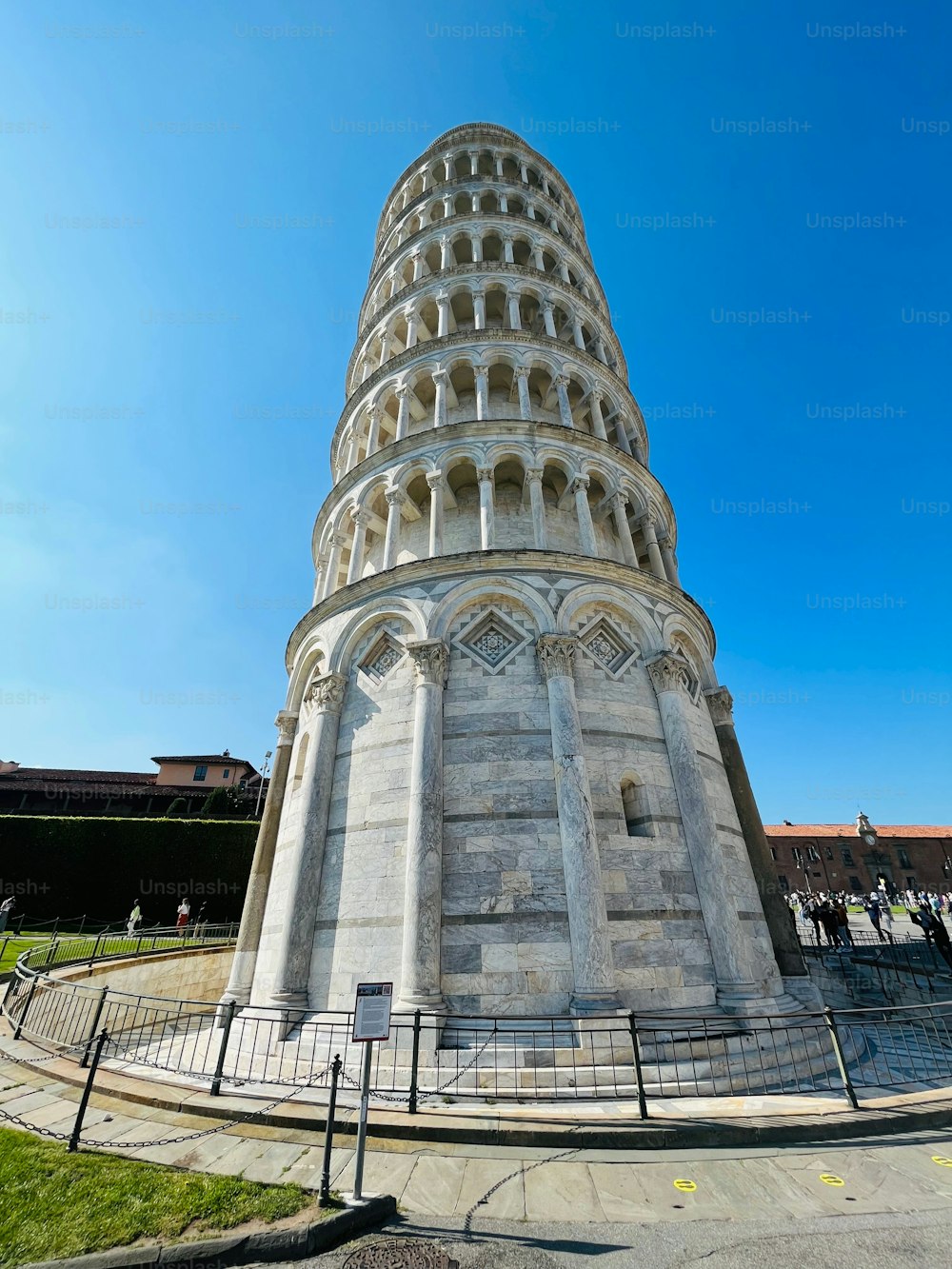 The majestic Leaning Tower of Pisa on a sunny day against a blue sky, Italy