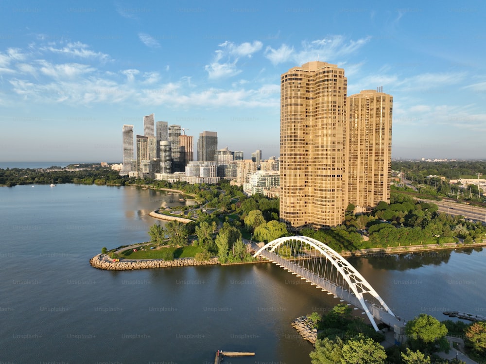 Toronto's Humber River Bridge during the early morning hours. This image showcases the bridge's graceful arches against Lake Ontario's tranquil waters