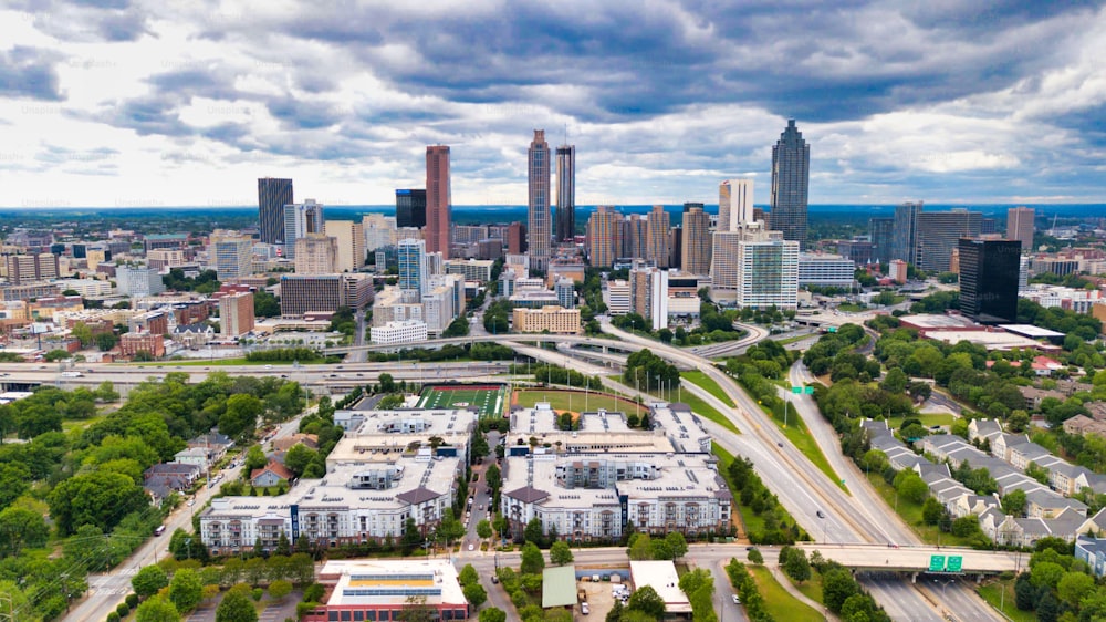 A beautiful panorama of Atlanta city with dense buildings under a cloudy sky in the USA
