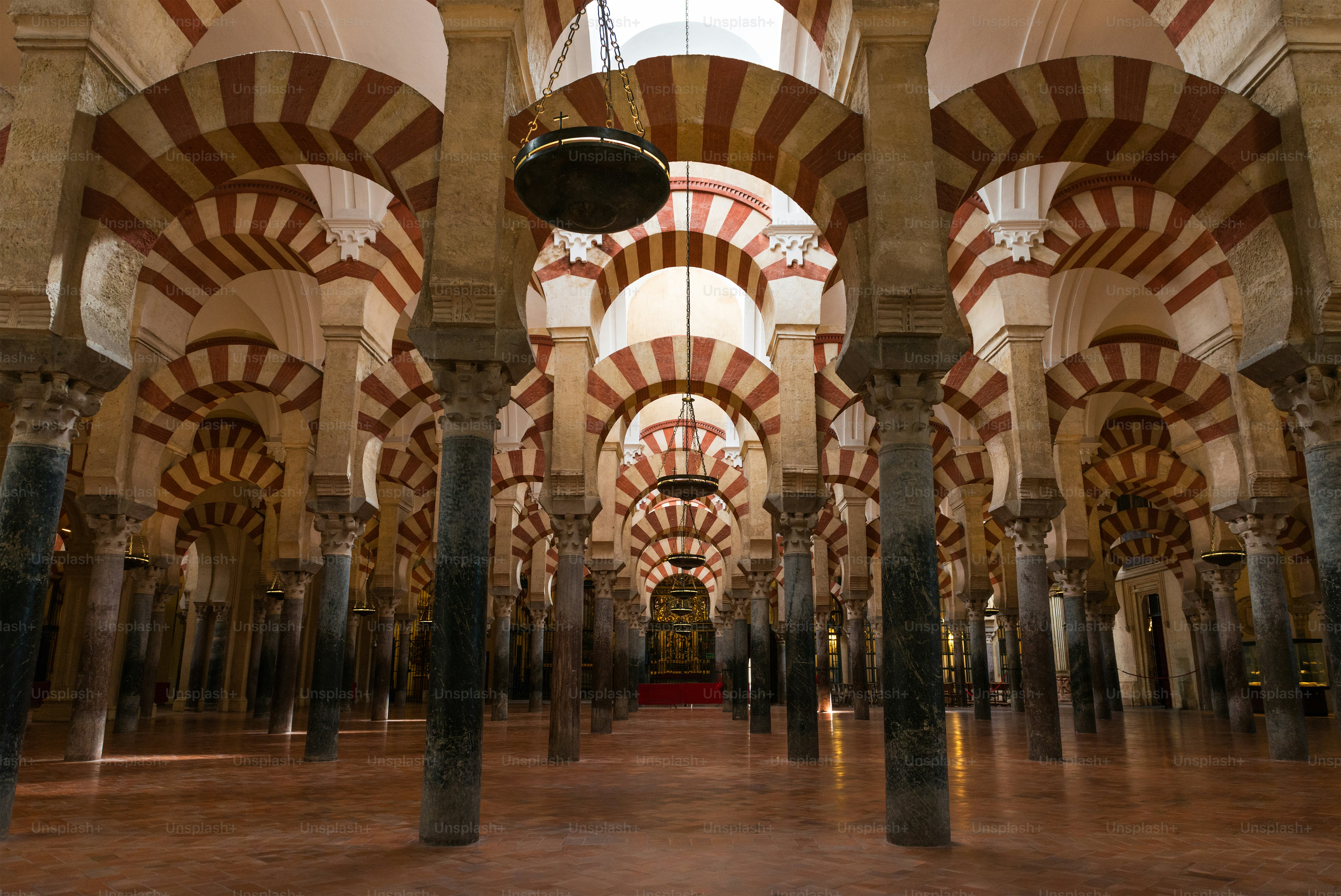 Inside view of the columns and decorated double arches of La Mezquita Catedral (Mosque Cathedral) of Córdoba, Spain.