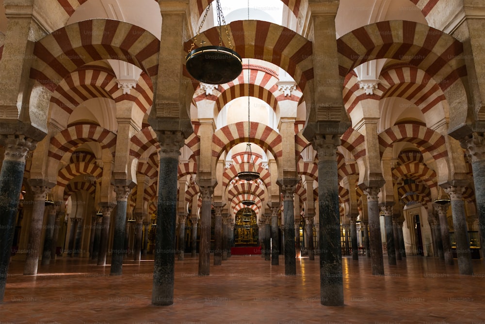 Inside view of the columns and decorated double arches of La Mezquita Catedral (Mosque Cathedral) of Córdoba, Spain.