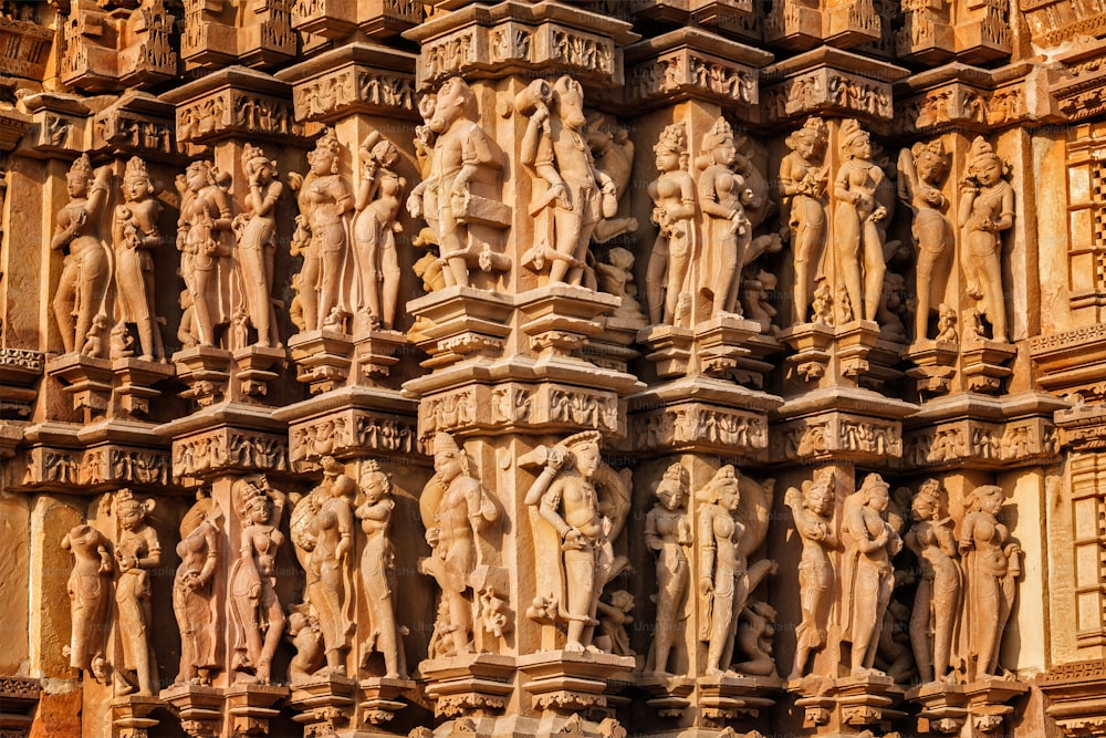 Stone carving bas relief sculptures on Vaman Temple, famous indian tourist site Khajuraho, Madhya Pradesh, India