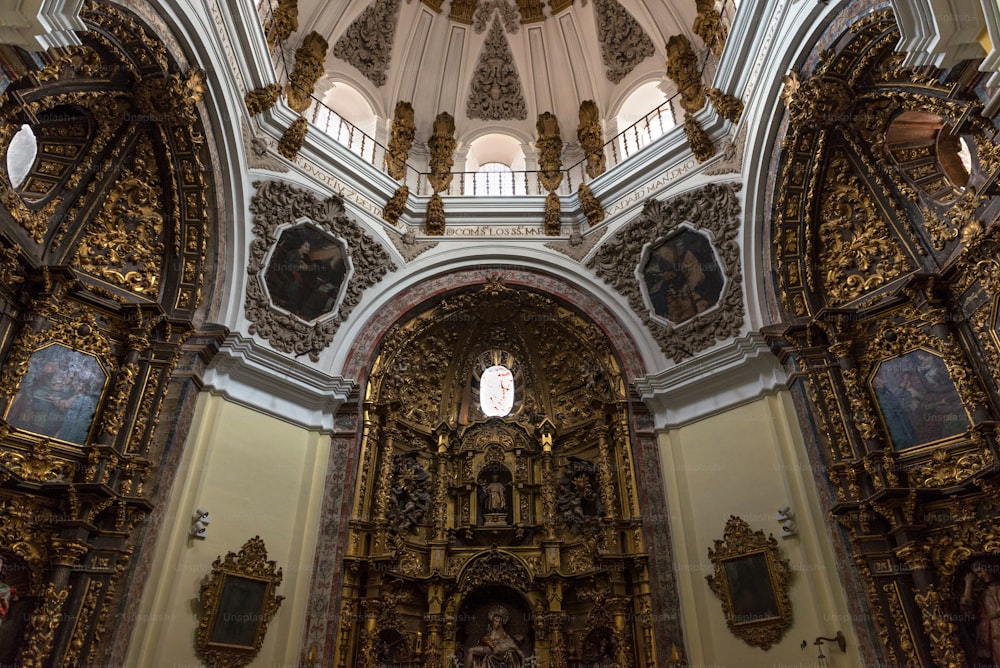 Inside view of one of the side chapels in the Colegiata de Antolin church in Toledo, a side church built in the XVII century in exalted baroque style as an extension to the Colegiata.