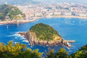 Santa Clara Island and San Sebastian Donostia city aerial panoramic view, Basque country in Spain