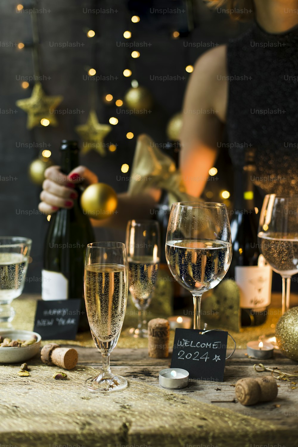 a table topped with wine glasses and bottles of wine