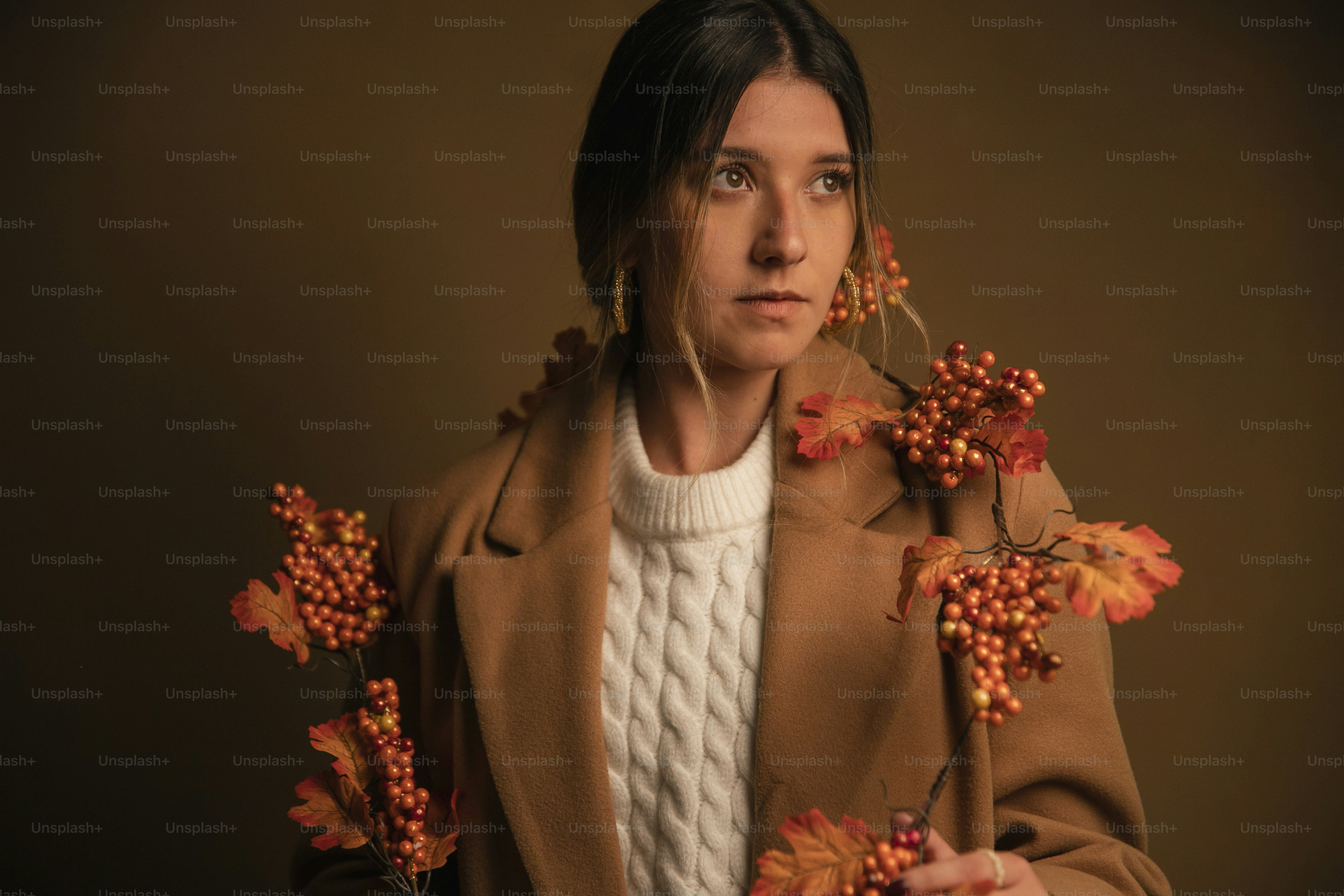 A woman holding a bunch of flowers in her hands photo – Fashion Image ...