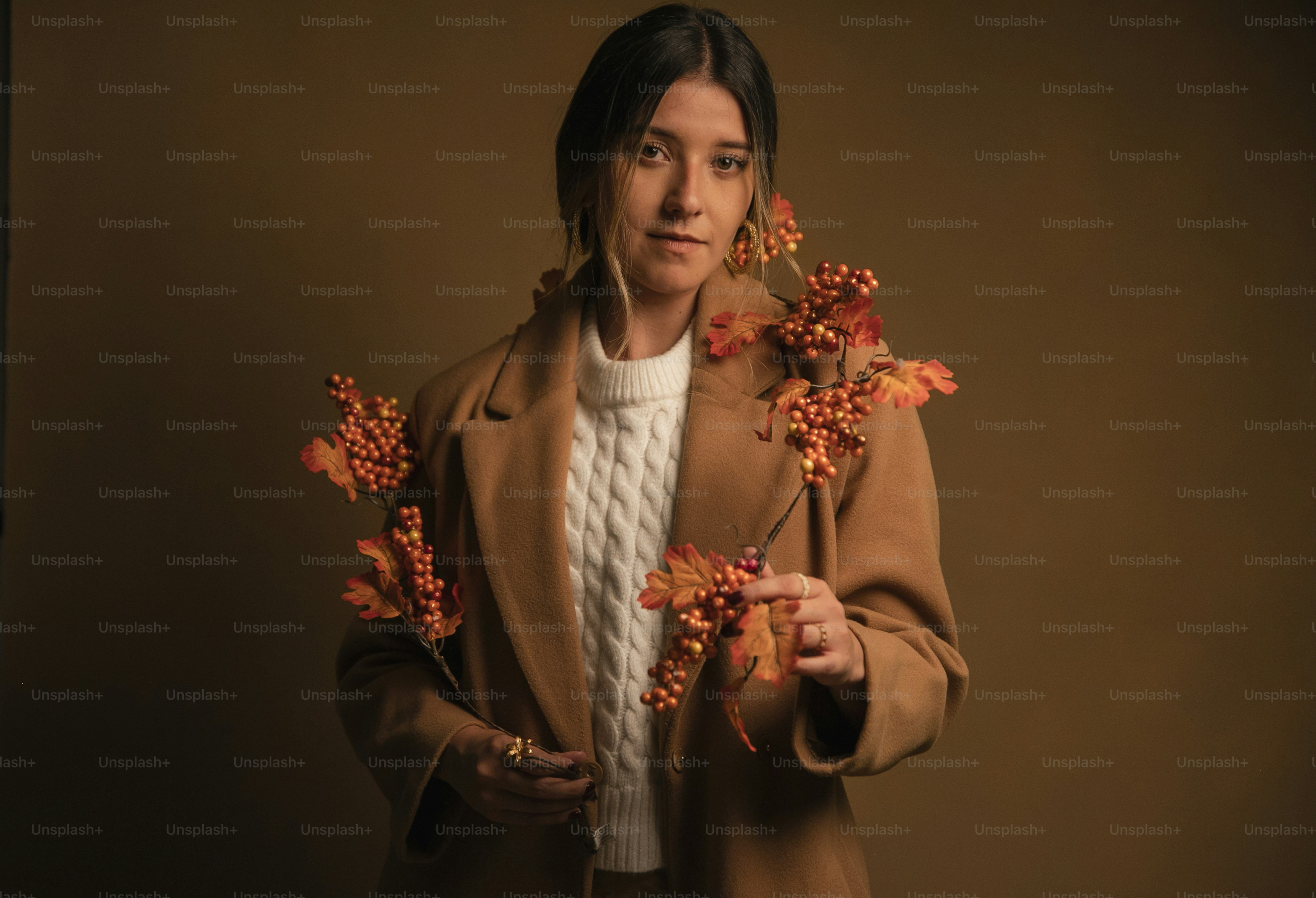 A woman is holding flowers in her hands photo – Autumn Image on Unsplash
