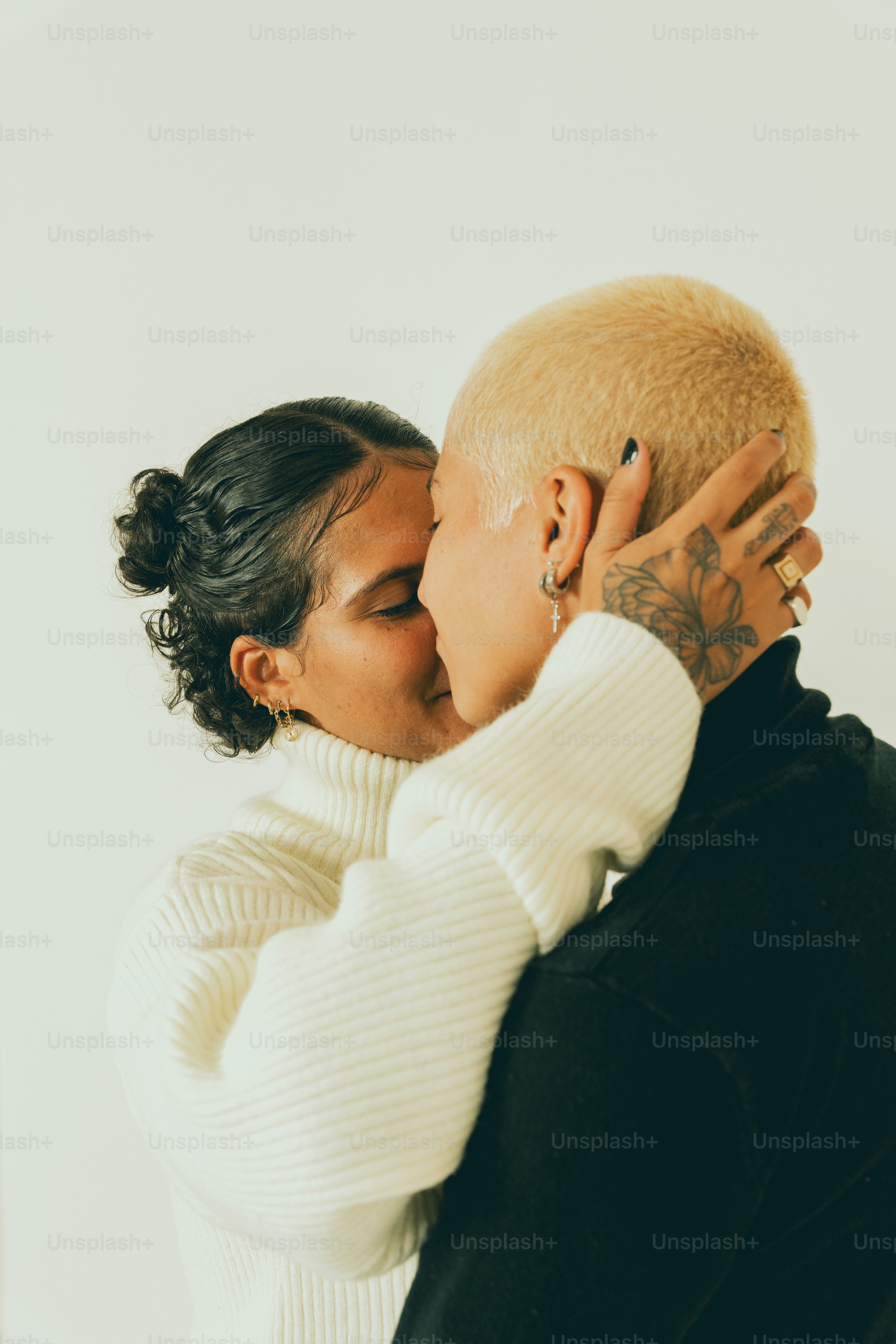 a man and a woman kissing each other