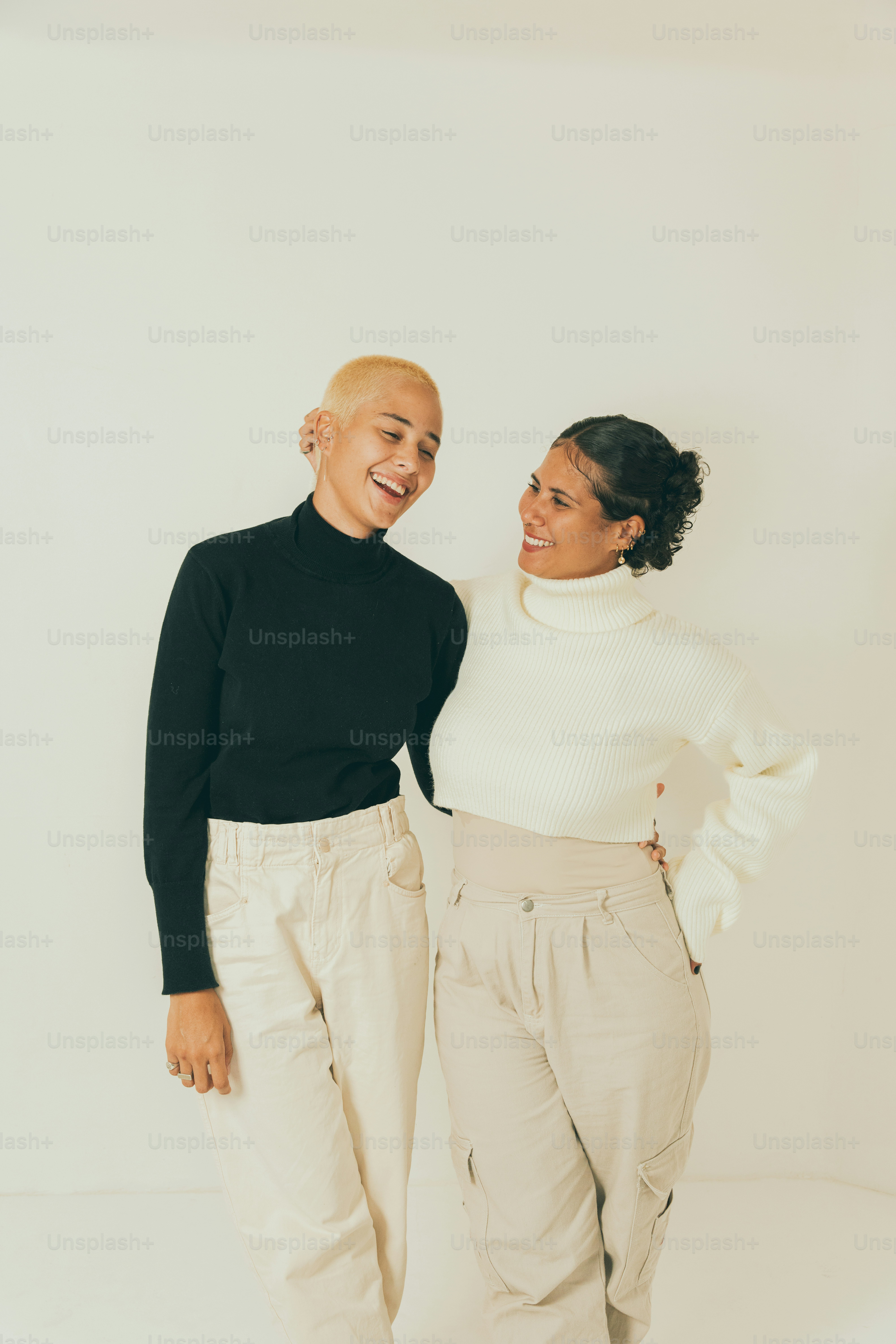 a couple of women standing next to each other